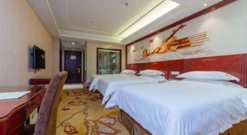 Bed in Vienna Hotel Guangzhou Huadu Sunac Cultural Tourism City Shiling
