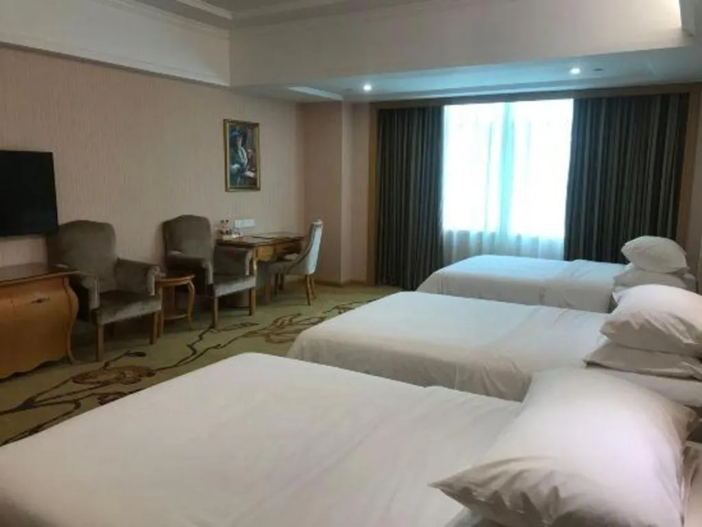 Bed in Vienna Hotel Guangzhou Huadu Sunac Cultural Tourism City Shiling
