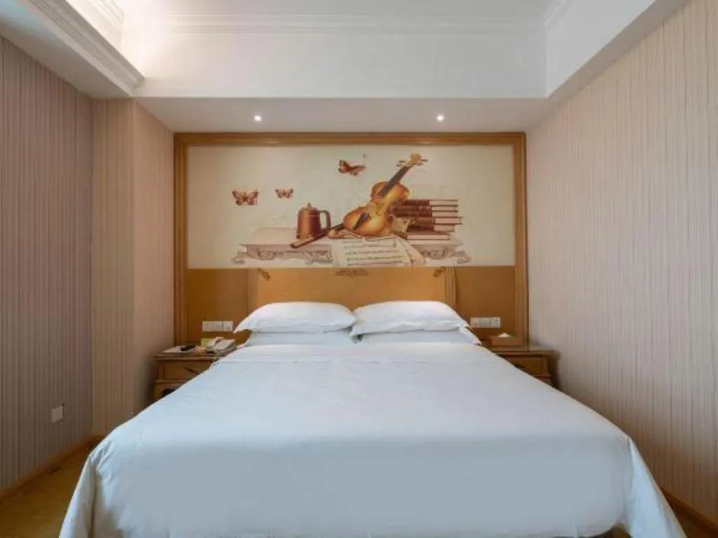 Bed in Vienna Hotel Guangzhou Huadu Sunac Cultural Tourism City Shiling