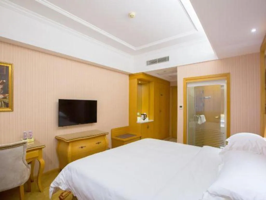 Bed in Vienna Hotel Guangzhou Huadu Sunac Cultural Tourism City Shiling