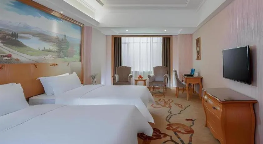Bed in Vienna Hotel Guangzhou Huadu Sunac Cultural Tourism City Shiling