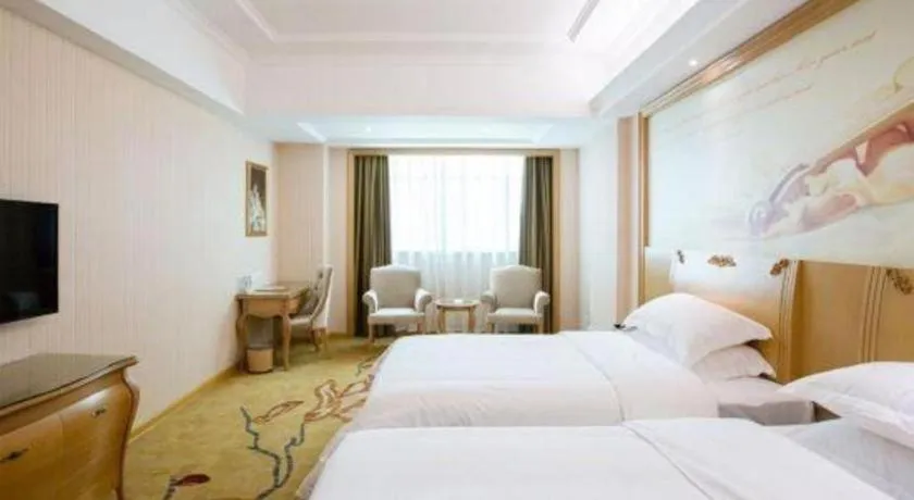 Bed in Vienna Hotel Guangzhou Huadu Sunac Cultural Tourism City Shiling