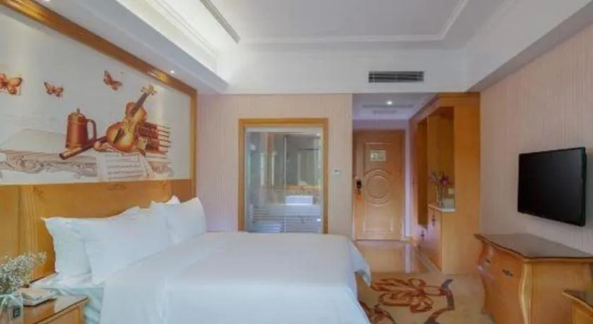 Bed in Vienna Hotel Guangzhou Huadu Sunac Cultural Tourism City Shiling