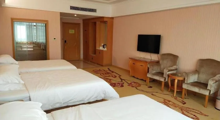 Bed in Vienna Hotel Guangzhou Huadu Sunac Cultural Tourism City Shiling