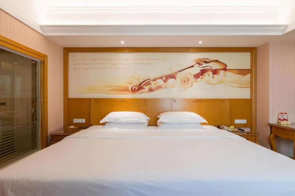 Bed in Vienna Hotel Guangzhou Huadu Sunac Cultural Tourism City Shiling