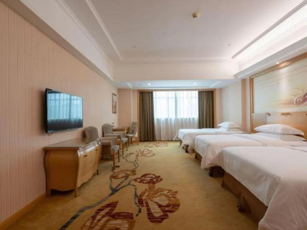 Bed in Vienna Hotel Guangzhou Huadu Sunac Cultural Tourism City Shiling