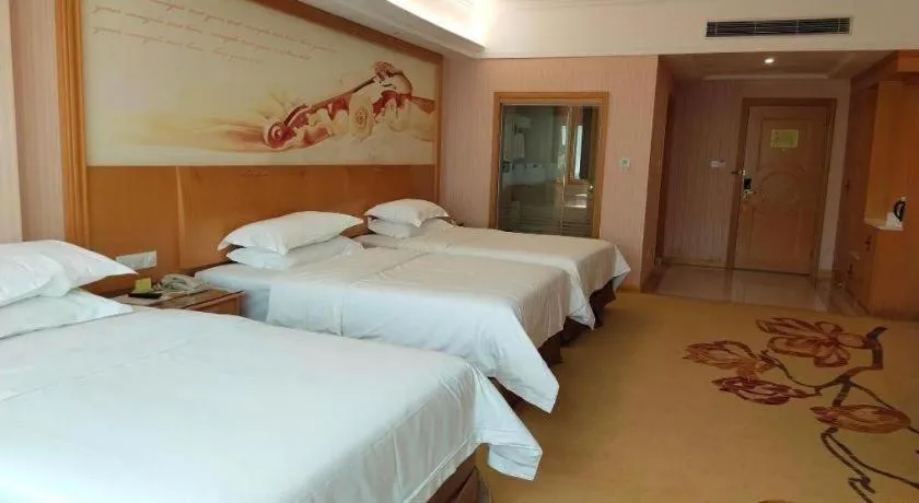 Bed in Vienna Hotel Guangzhou Huadu Sunac Cultural Tourism City Shiling