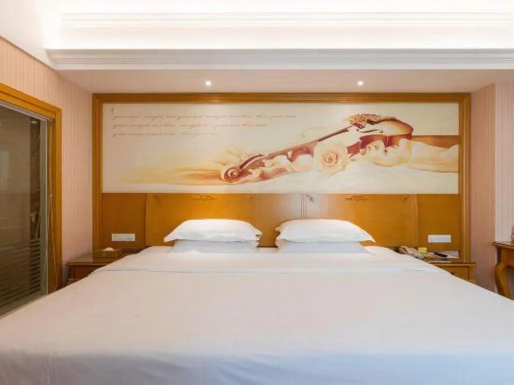 Bed in Vienna Hotel Guangzhou Huadu Sunac Cultural Tourism City Shiling