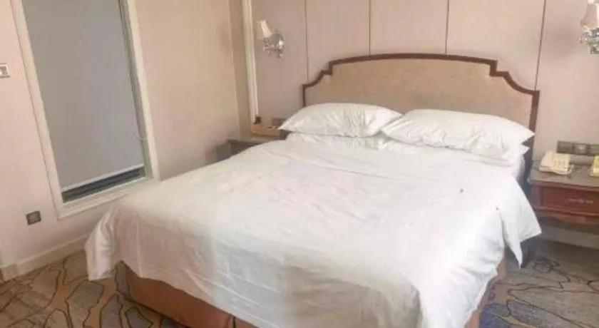 Bed in Vienna Hotel Guangzhou Baiyun College Jinyuan Plaza