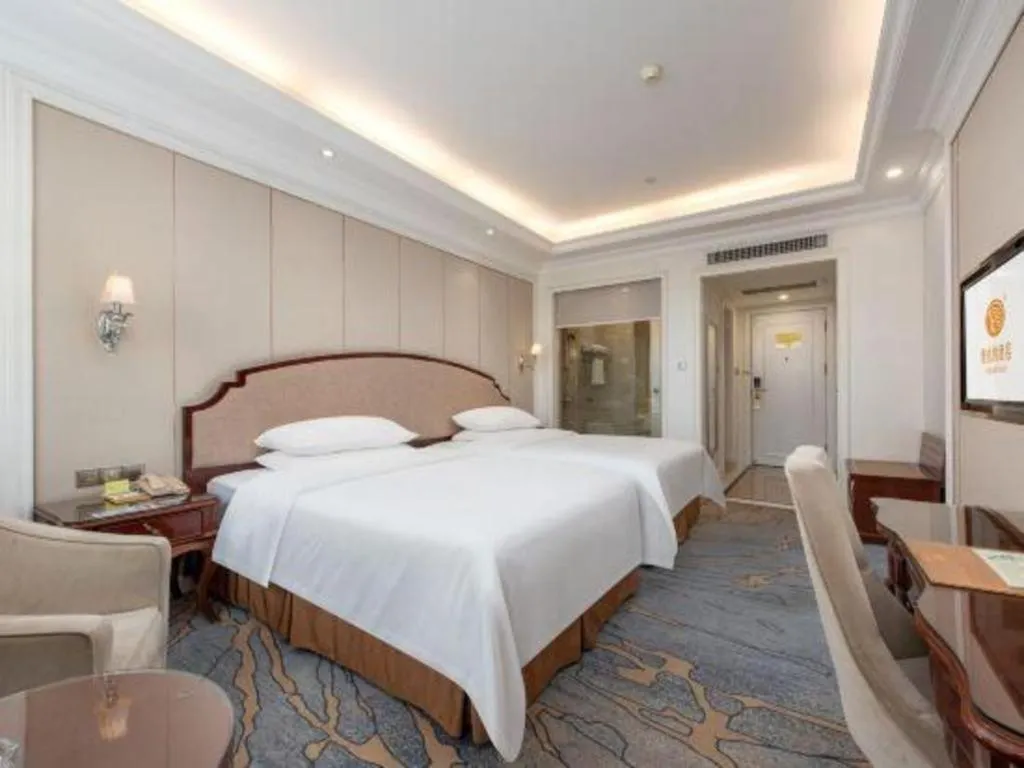 Bed in Vienna Hotel Guangzhou Baiyun College Jinyuan Plaza