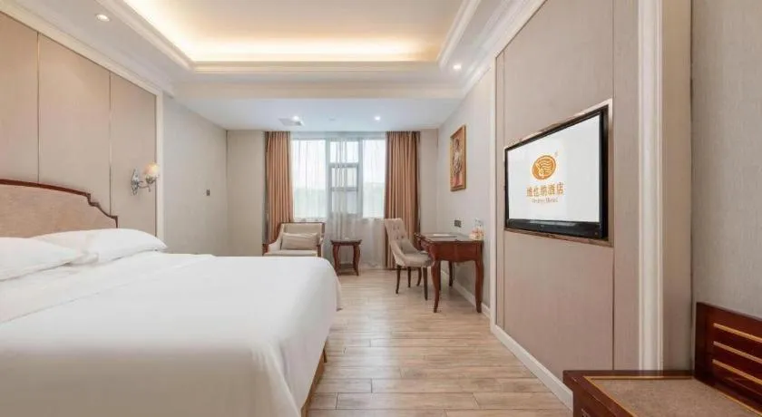 Bed in Vienna Hotel Guangzhou Baiyun College Jinyuan Plaza