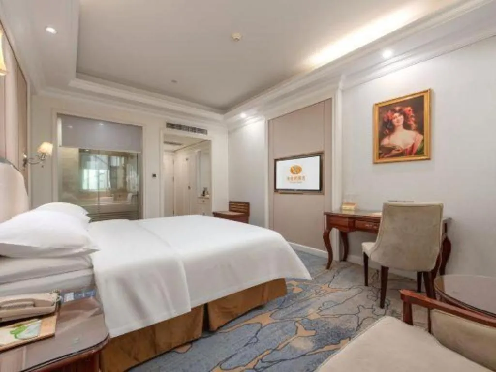 Bed in Vienna Hotel Guangzhou Baiyun College Jinyuan Plaza