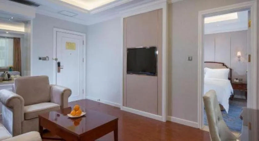 Bed in Vienna Hotel Guangzhou Baiyun College Jinyuan Plaza