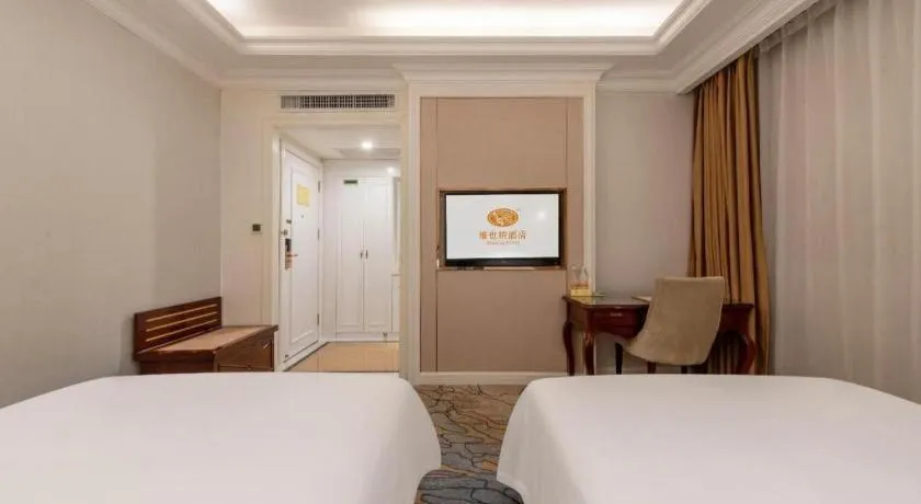 Bed in Vienna Hotel Guangzhou Baiyun College Jinyuan Plaza