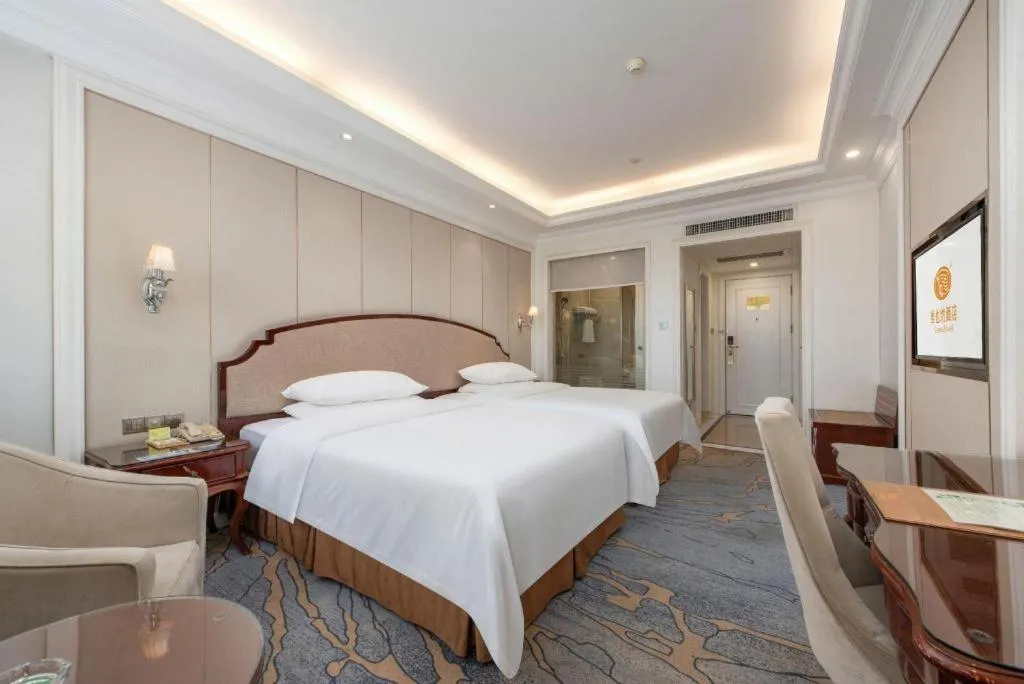 Bed in Vienna Hotel Guangzhou Baiyun College Jinyuan Plaza