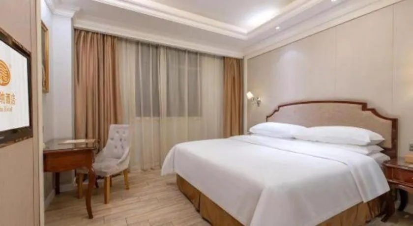 Bed in Vienna Hotel Guangzhou Baiyun College Jinyuan Plaza