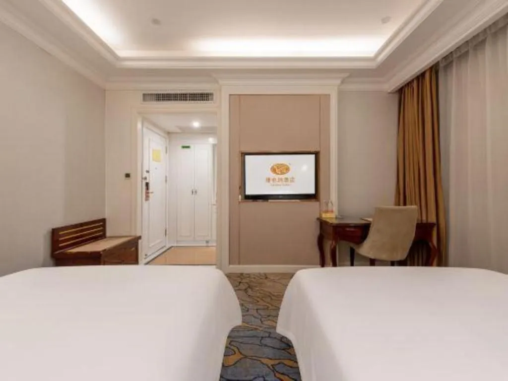 Bed in Vienna Hotel Guangzhou Baiyun College Jinyuan Plaza