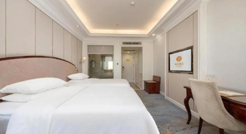 Bed in Vienna Hotel Guangzhou Baiyun College Jinyuan Plaza