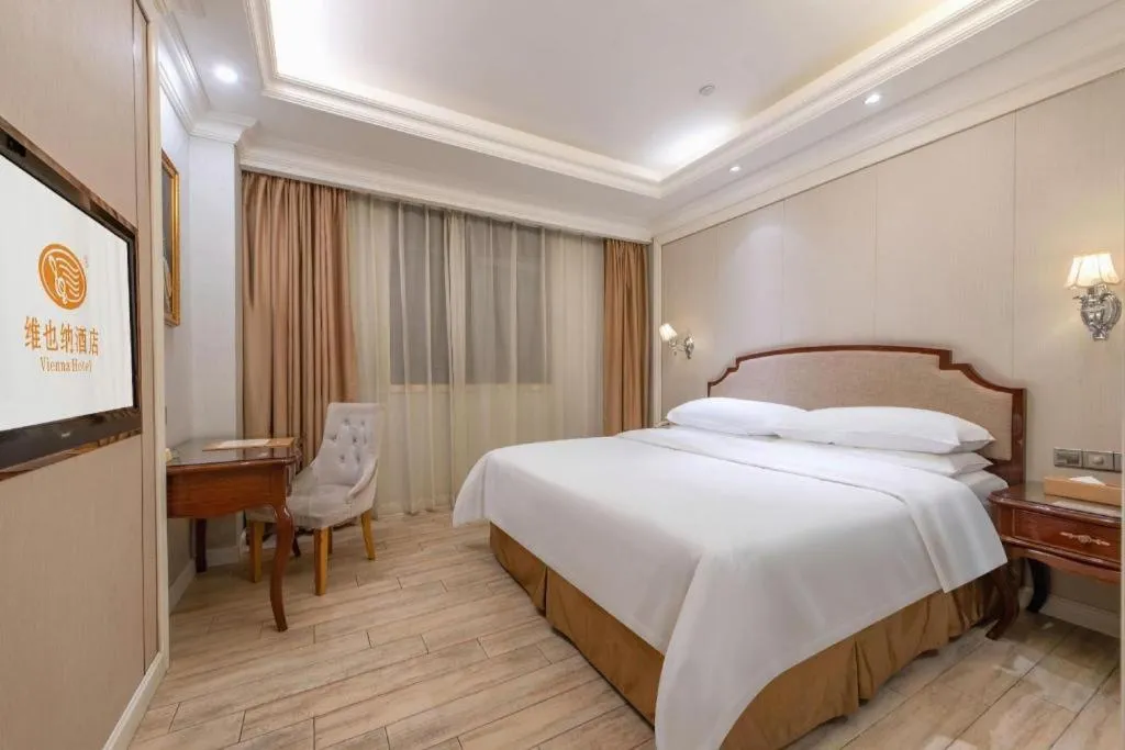 Bed in Vienna Hotel Guangzhou Baiyun College Jinyuan Plaza