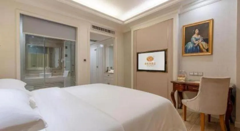 Bed in Vienna Hotel Guangzhou Baiyun College Jinyuan Plaza