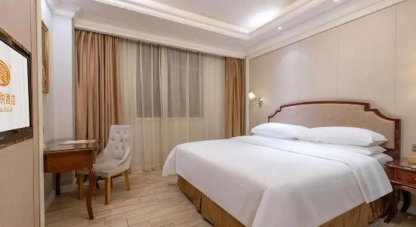 Bed in Vienna Hotel Guangzhou Baiyun College Jinyuan Plaza