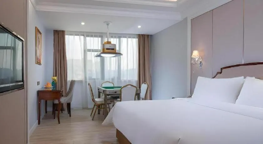 Bed in Vienna Hotel Guangzhou Baiyun College Jinyuan Plaza