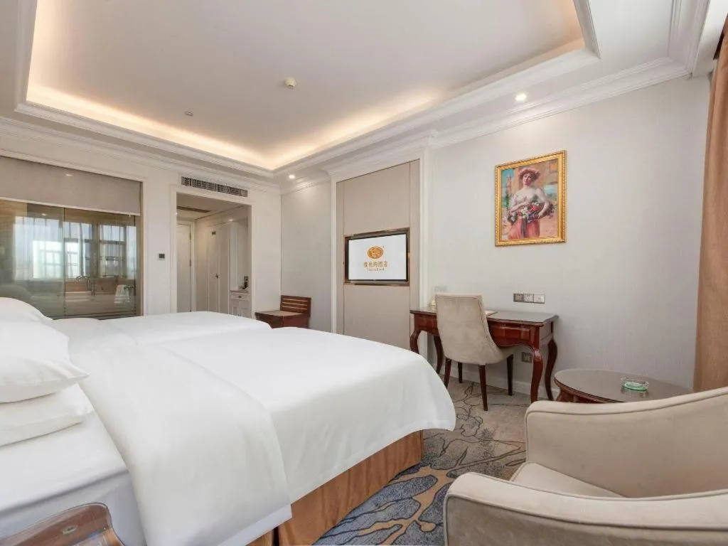 Bed in Vienna Hotel Guangzhou Baiyun College Jinyuan Plaza