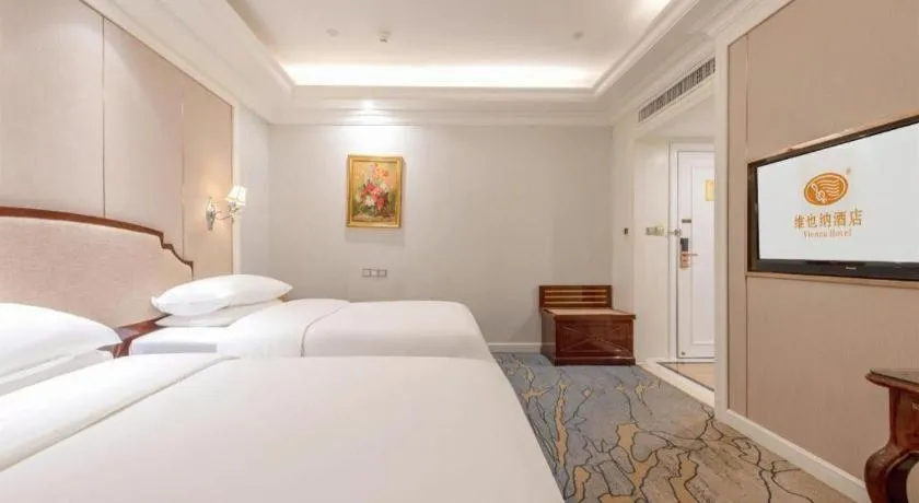 Bed in Vienna Hotel Guangzhou Baiyun College Jinyuan Plaza