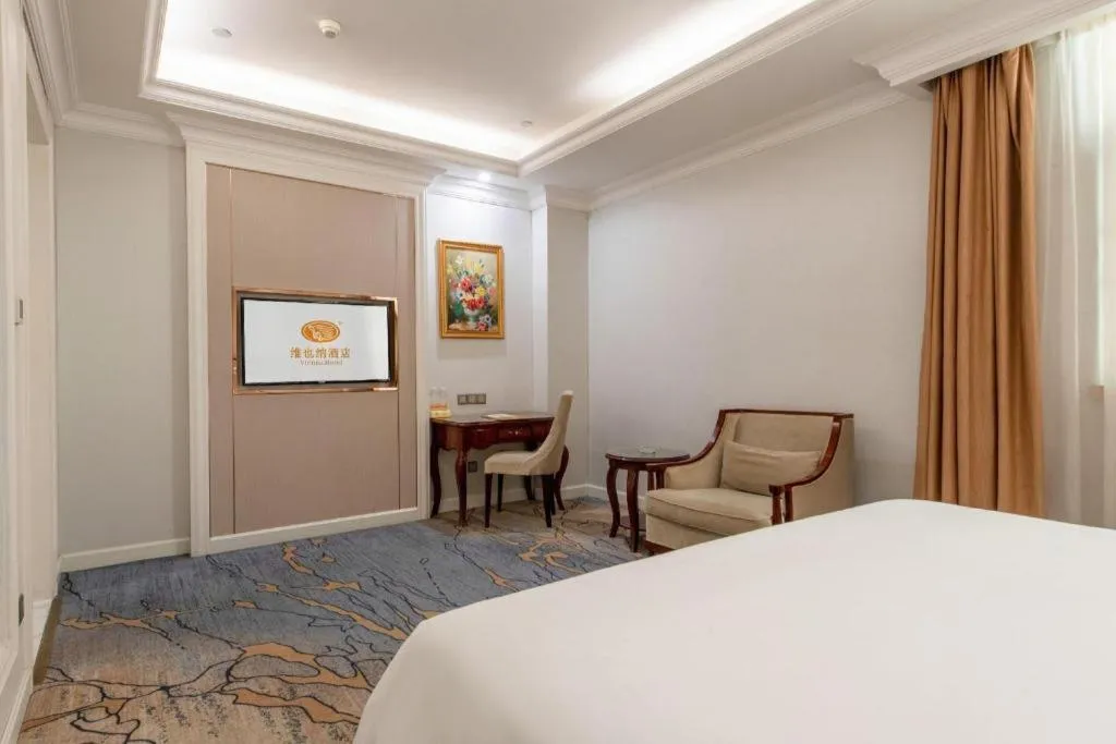 Bed in Vienna Hotel Guangzhou Baiyun College Jinyuan Plaza