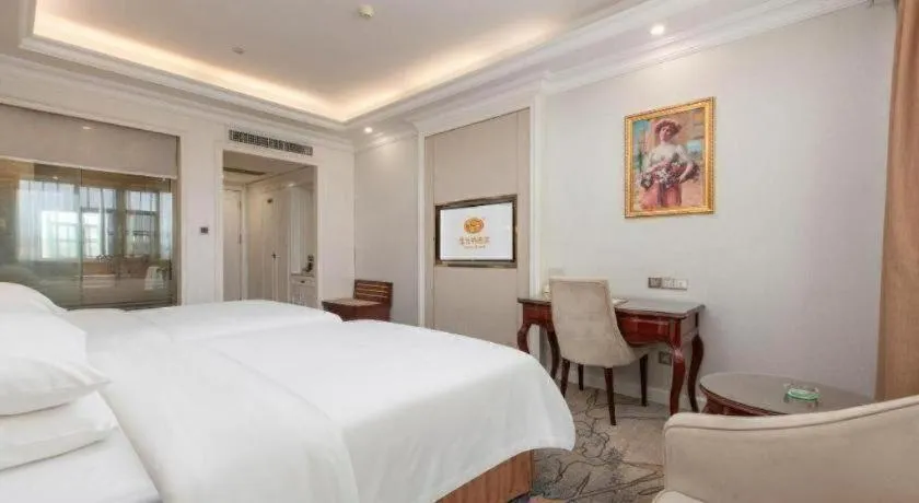 Bed in Vienna Hotel Guangzhou Baiyun College Jinyuan Plaza