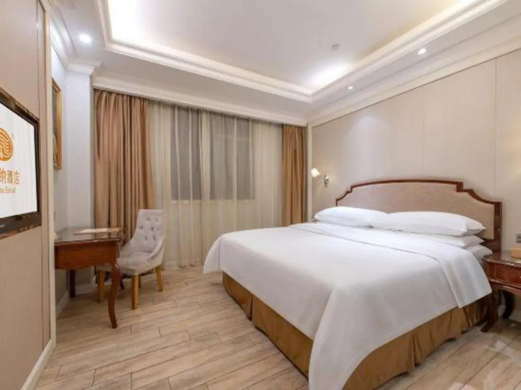 Bed in Vienna Hotel Guangzhou Baiyun College Jinyuan Plaza