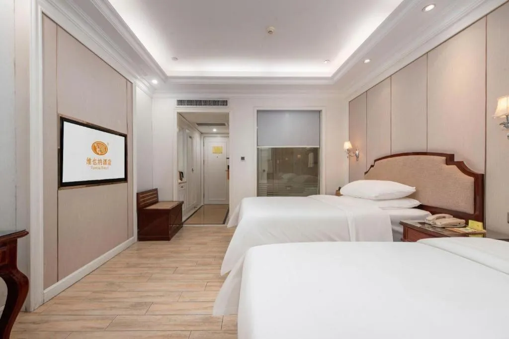 Bed in Vienna Hotel Guangzhou Baiyun College Jinyuan Plaza