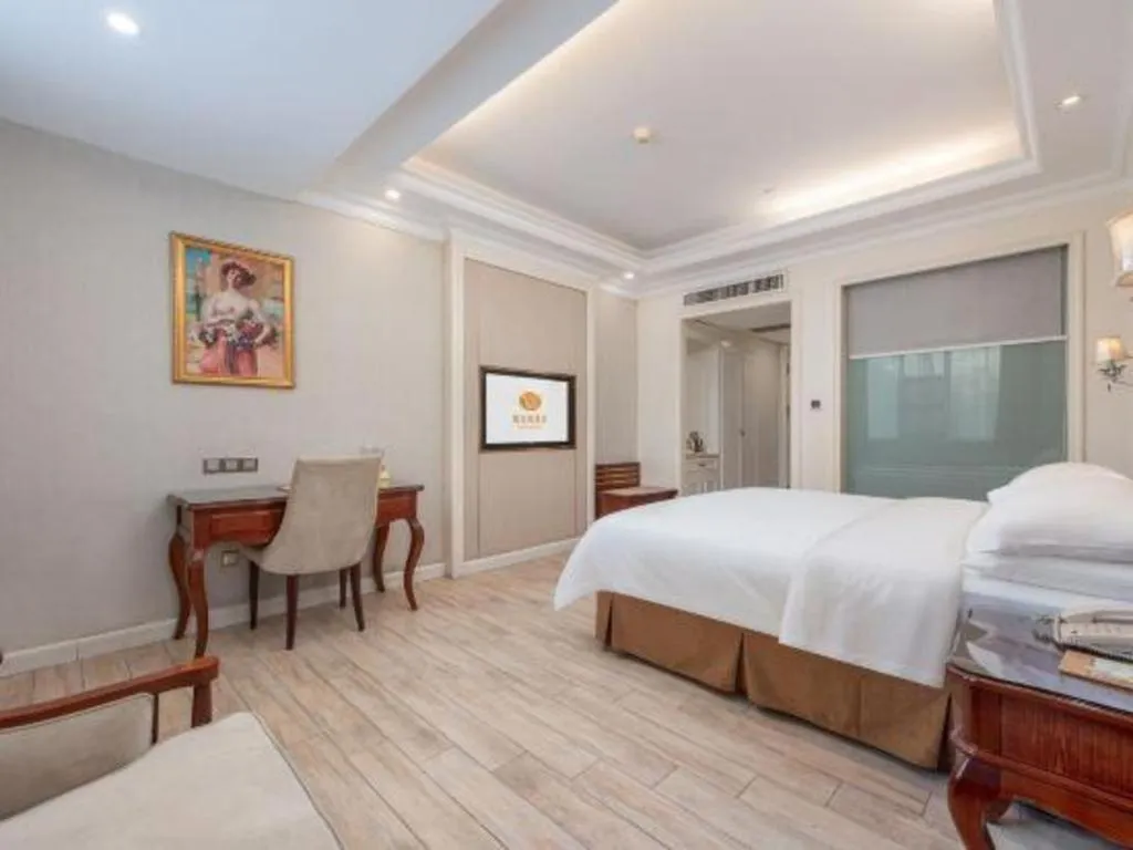 Bed in Vienna Hotel Guangzhou Baiyun College Jinyuan Plaza