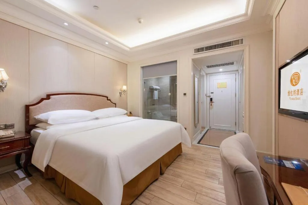 Bed in Vienna Hotel Guangzhou Baiyun College Jinyuan Plaza
