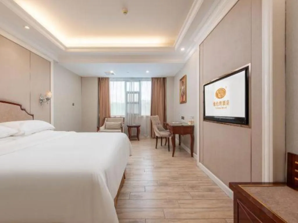 Bed in Vienna Hotel Guangzhou Baiyun College Jinyuan Plaza