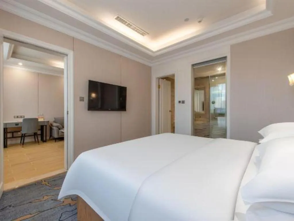 Bed in Vienna Hotel Guangzhou Baiyun College Jinyuan Plaza