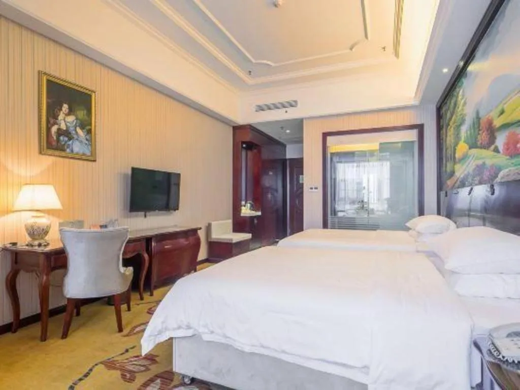 Bed in Vienna Hotel Jiangxi Ji'an Anfu