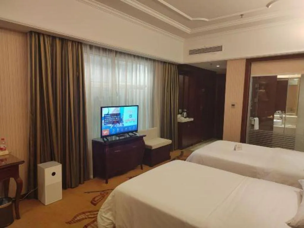 Bed in Vienna Hotel Jiangxi Ji'an Anfu