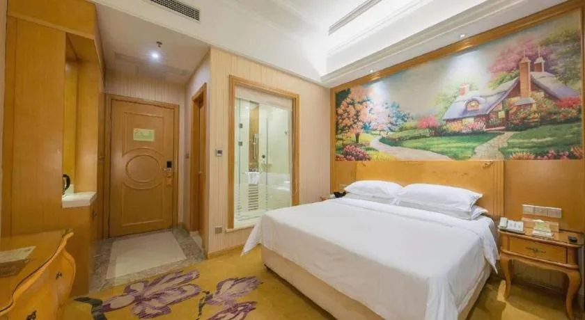 Bed in Vienna Hotel Jiangxi Ji'an Anfu