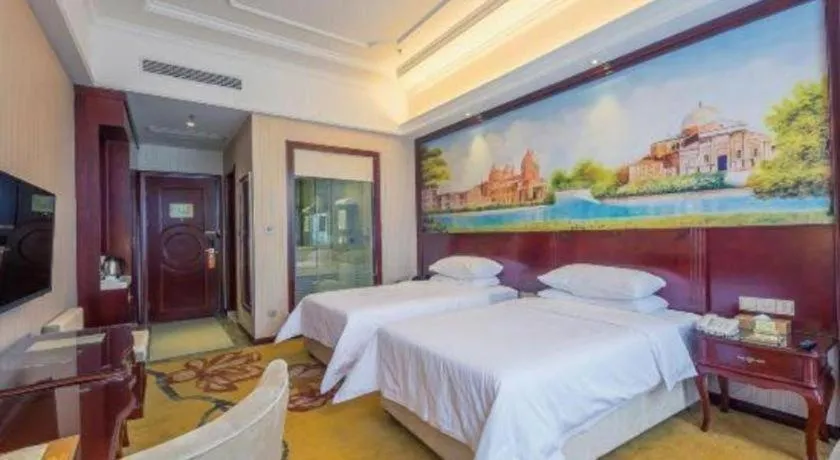 Bed in Vienna Hotel Jiangxi Ji'an Anfu