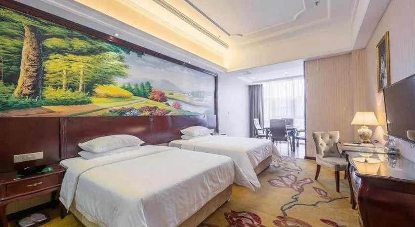 Bed in Vienna Hotel Jiangxi Ji'an Anfu