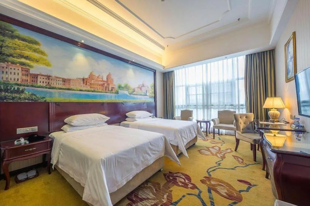 Bed in Vienna Hotel Jiangxi Ji'an Anfu