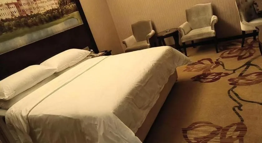 Bed in Vienna Hotel Jiangxi Ji'an Anfu