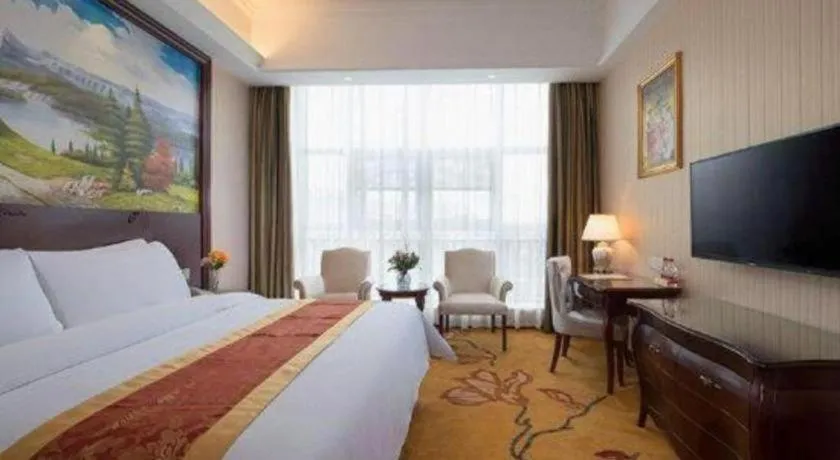 Bed in Vienna Hotel Jiangxi Ji'an Anfu