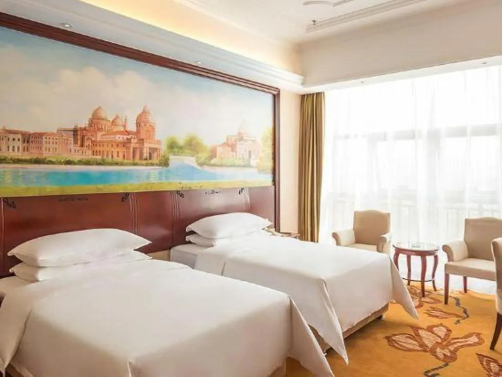 Bed in Vienna Hotel Jiangxi Ji'an Anfu