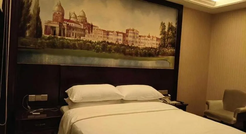 Bed in Vienna Hotel Jiangxi Ji'an Anfu