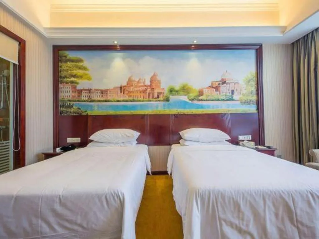 Bed in Vienna Hotel Jiangxi Ji'an Anfu