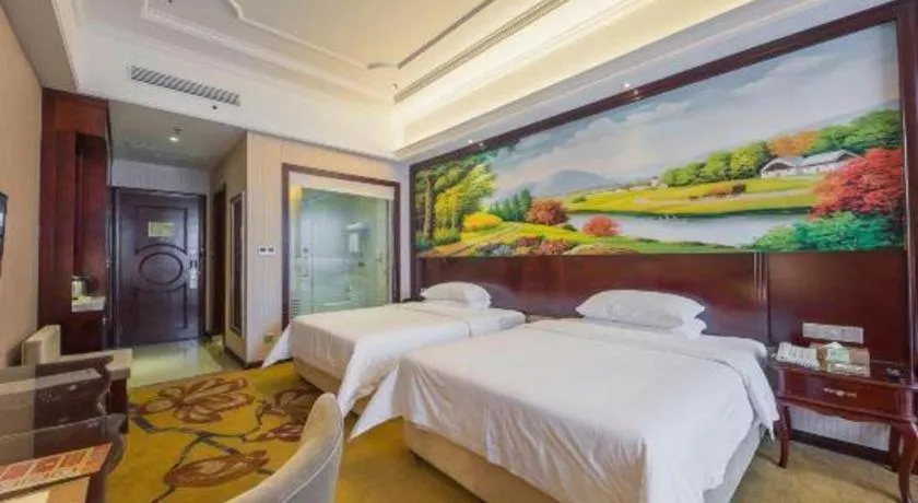 Bed in Vienna Hotel Jiangxi Ji'an Anfu