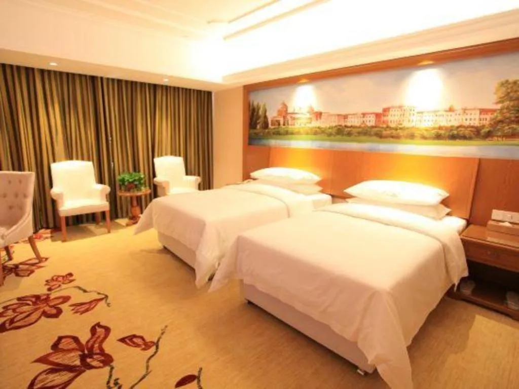 Bed in Vienna Hotel Jiangxi Ji'an Anfu