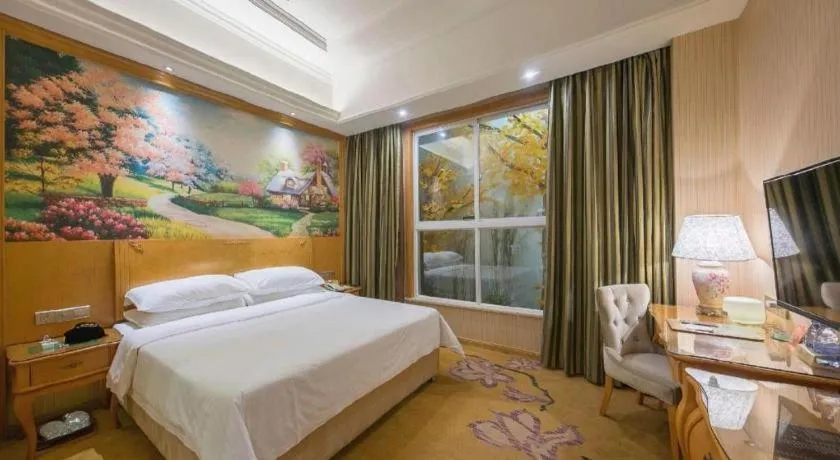 Bed in Vienna Hotel Jiangxi Ji'an Anfu